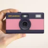Appareil photo peeksme rose + 1 paire de clips jaune + 1 lanière bleue