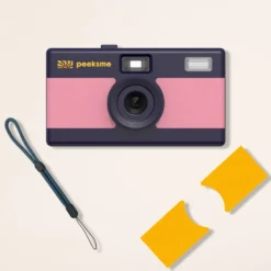 Appareil photo peeksme rose + 1 paire de clips jaune + 1 lanière bleue