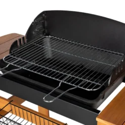 Barbecue à charbon de bois en fonte, grille en acier chromé, sur chariot.
