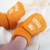 Chaussons naissance - mini nous #edbe00