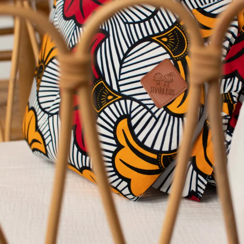Gigoteuse emmaillotage coton wax rouge