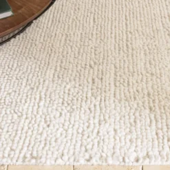 Sacha - tapis rectangulaire 200x290cm en laine bouclée couleur beige